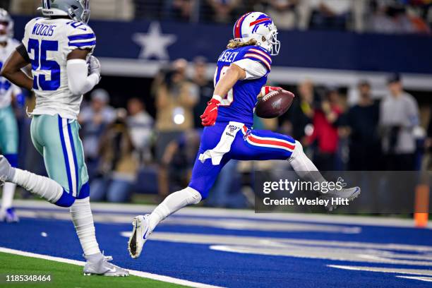 Cole Beasley of the Buffalo Bills runs a pass in for a touchdown in the second quarter on Thanksgiving Day during a game against the Dallas Cowboys...