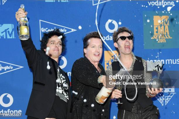 Billie Joe Armstrong, Tre Cool and Mike Dirnt of Green Day pose in the winners room during the MTV EMAs 2019 at FIBES Conference and Exhibition...