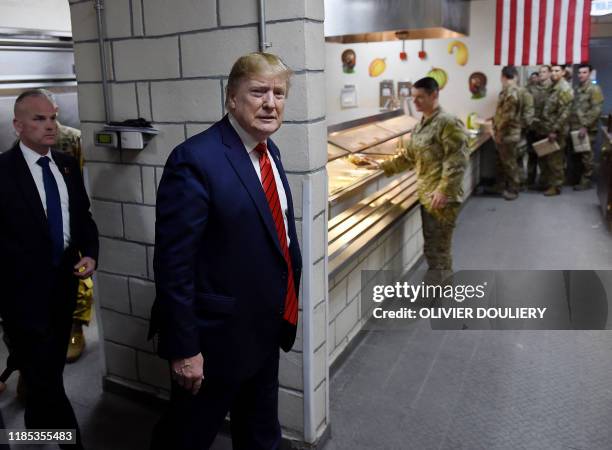 President Donald Trump arrives to serve Thanksgiving dinner to US troops during a surprise visit at Bagram Air Field, on November 28, 2019 in...