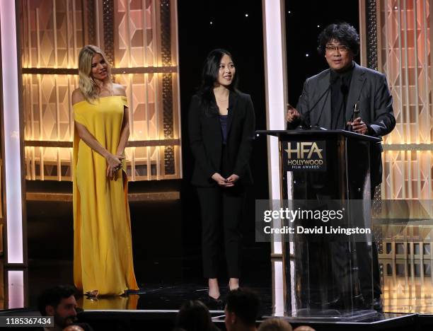 Sienna Miller presents Bong Joon Ho with the Hollywood Filmmaker Award during the 23rd Annual Hollywood Film Awards show at The Beverly Hilton Hotel...