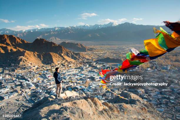 the person look at sunset and leh city in leh ladakh, india. - ladakh imagens e fotografias de stock