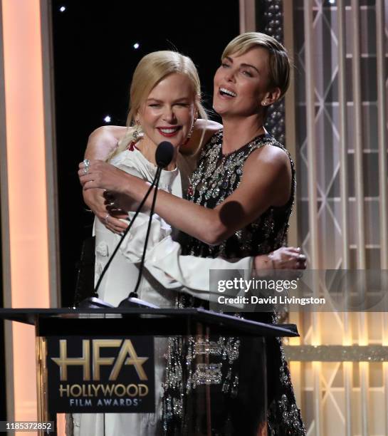 Nicole Kidman presents Charlize Theron with the Hollywood Career Achievement Award onstage during the 23rd Annual Hollywood Film Awards show at The...