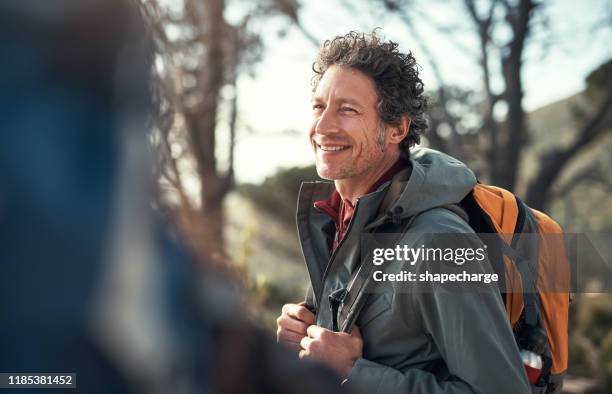 you're one hike away from a happy day - male backpacker stock pictures, royalty-free photos & images