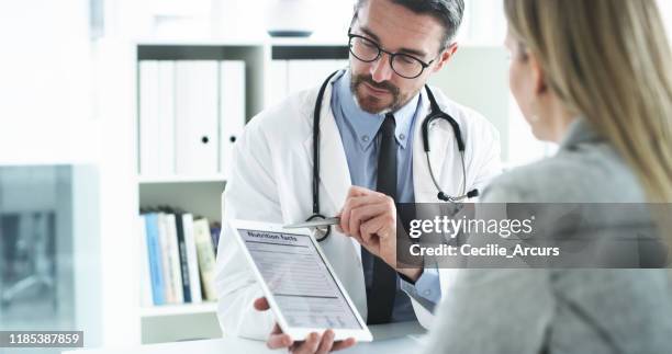 your doctor's got all the nutrition facts you need - nutricionista imagens e fotografias de stock