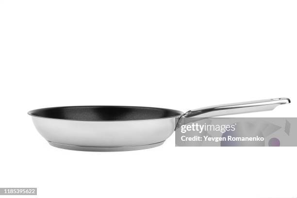 chrome frying pan with a non-stick teflon coating, isolated over the white background - pots and pans stock-fotos und bilder