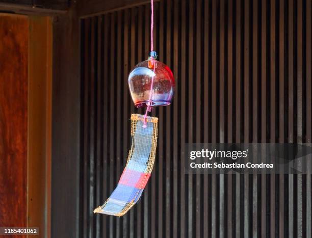 wind bell which is a japanese common feature in the summer time, japan travel, jr route. - wind chime stock pictures, royalty-free photos & images