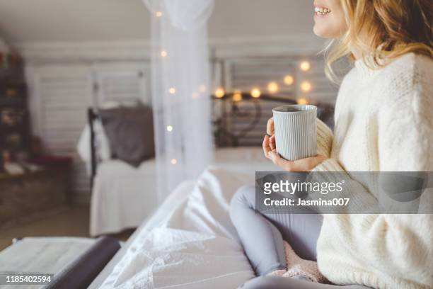 beautiful young woman drinking coffee at home - cosy stock pictures, royalty-free photos & images
