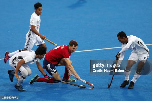 Harry Martin of Great Britain controls the ball during the Olympic Qualifier match between Great Britain and Malaysia at Lee Valley Hockey and Tennis...