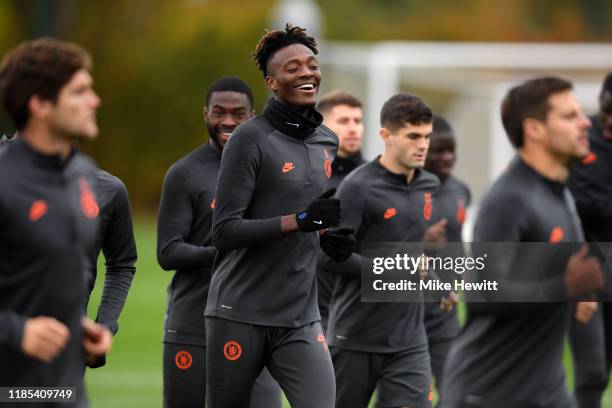 Tammy Abraham of Chelsea reacts during a training session ahead of their UEFA Champions League Group H match against Ajax at Chelsea Training Ground...