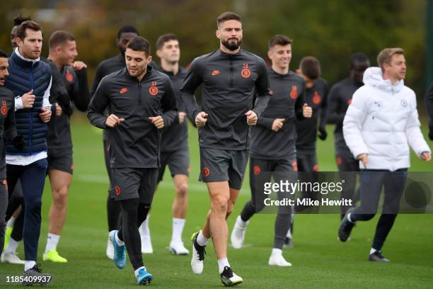 Mateo Kovacic and Olivier Giroud of Chelsea participate in a training session ahead of their UEFA Champions League Group H match against Ajax at...