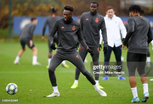 Tammy Abraham of Chelsea in action during a training session ahead of their UEFA Champions League Group H match against Ajax at Chelsea Training...