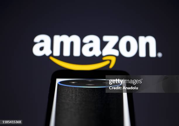 The logo of "Amazon", multinational technology company, is seen with the virtual assistant Alexa developed by Amazon, in Ankara, Turkey on November...