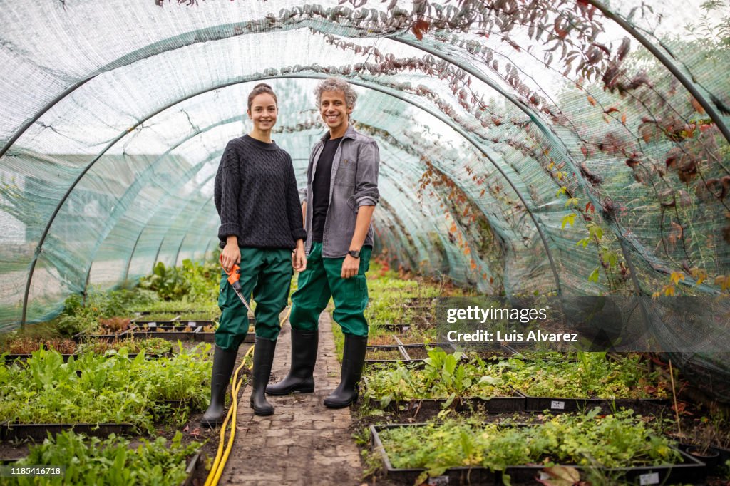 Two garden workers standing together