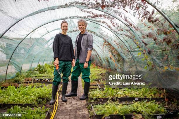 two garden workers standing together - content stock-fotos und bilder