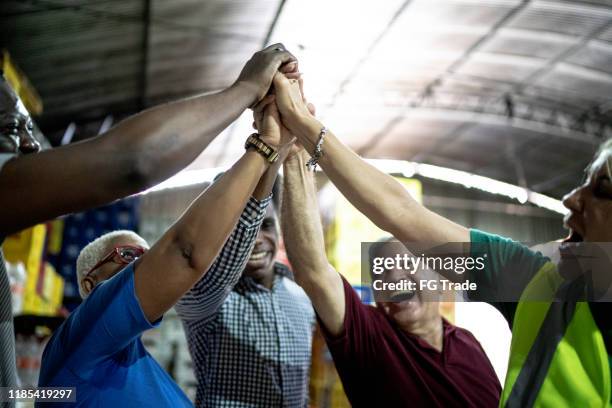 happy employees celebrating together at warehouse - colleague appreciation stock pictures, royalty-free photos & images