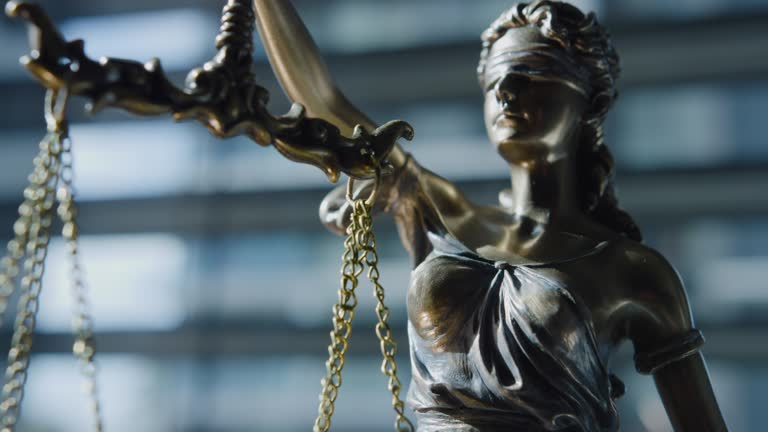 https://media.gettyimages.com/id/1185435145/video/lady-justice-blindfolded-and-holding-balance-scales-and-a-sword-crime-justice-court-and-law.jpg?b=1&s=640x640&k=20&c=eoz1pPxg--JUtUn4ZBrZ2taIWhZYX2LBeCuImx52lEo=