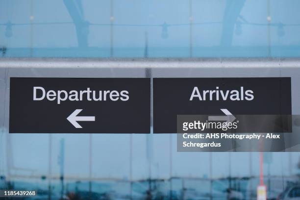 airport departures and arrivals outdoor signage in the rain - arrival stock pictures, royalty-free photos & images