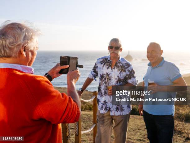 three old men take a photo