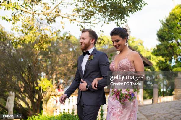 groomsman and bridesmaid entering at wedding ceremony - bridesmaid stock pictures, royalty-free photos & images