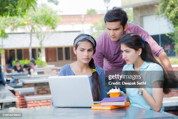 teen girl studies with classmates at university stock photo - all india students association stock pictures, royalty-free photos & images
