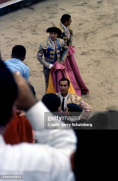 View, from the crowd, of Spanish bullfighter Luis Miguel Dominguin and his brother-in-law, fellow bullfighter Antonio Ordonez Araujo , along with a...