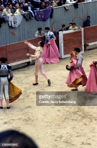 Spanish bullfighter Luis Miguel Dominguin tosses an object to the crowd in Arles Amphitheater, Arles, France, 1959.