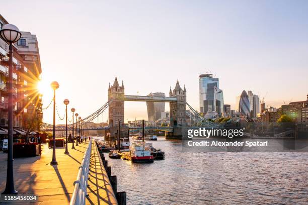 london skyline with tower bridge and skyscrapers of london city at sunset, england, uk - london england stock pictures, royalty-free photos & images