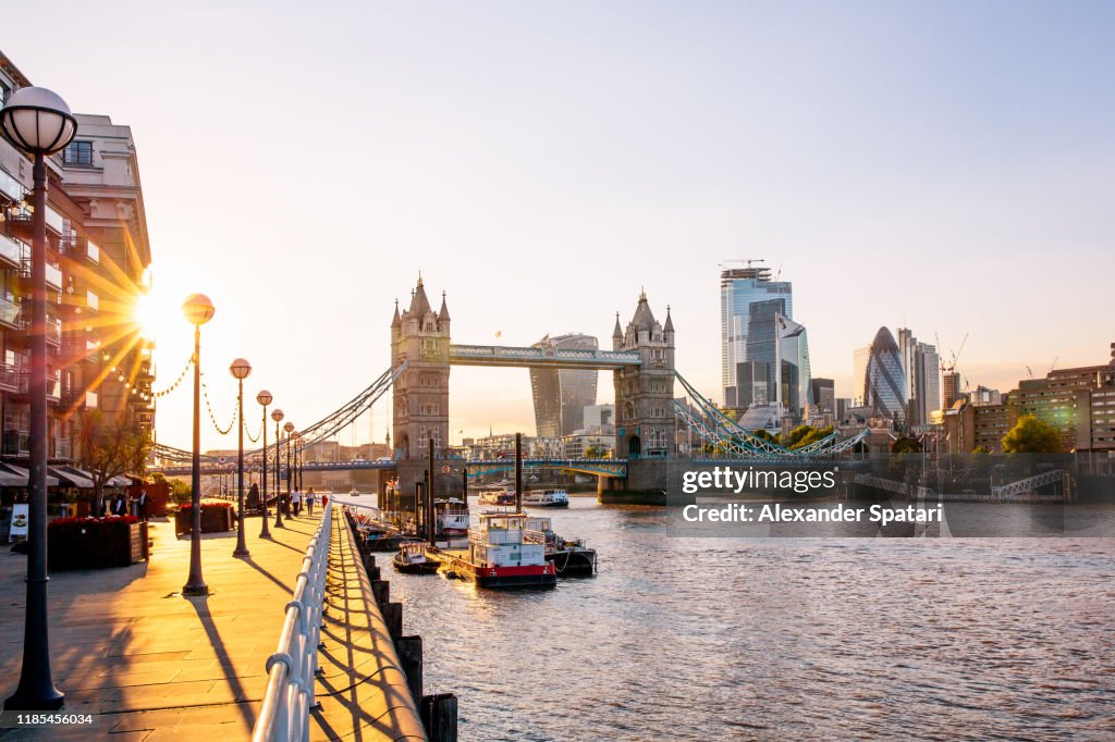 London skyline with Tower Bridge and skyscrapers of London City at sunset, England, UK