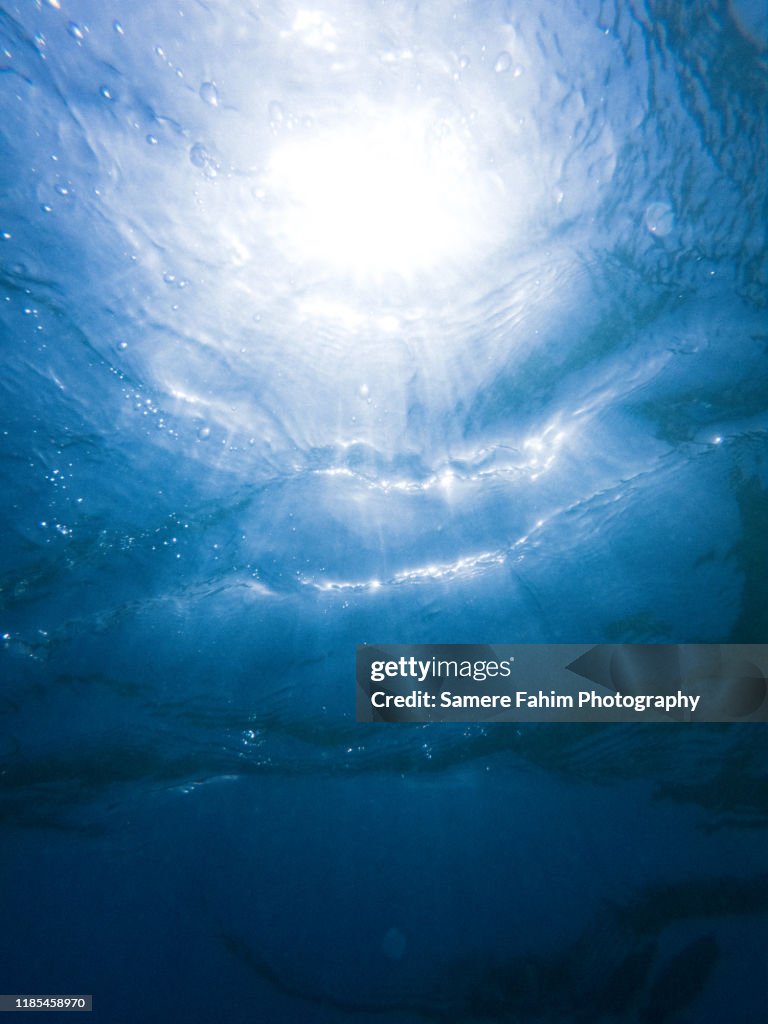 Sun rays going through water surface