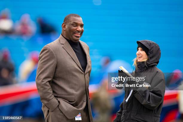 Senior Vice President of Player Personnel Doug Williams of the Washington Redskins speaks with Fox sports reporter Laura Okmin before the game...