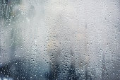 Rainy background, rain drops on the window, autumn season backdrop, abstract textured wallpaper