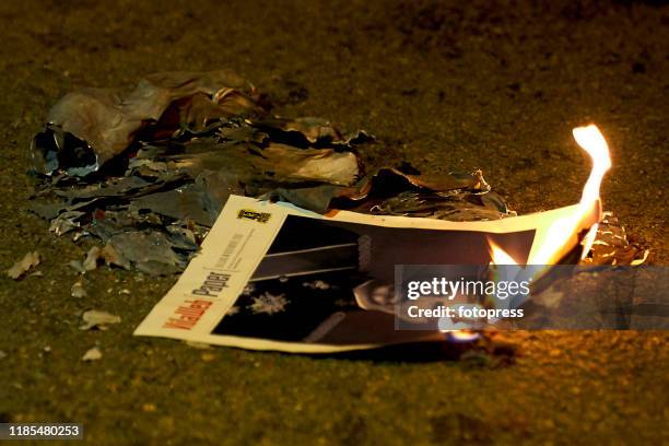 Demonstrators burn a picture of the Spanish king at the Diagonal Avenue, near the Palau de Congressos of Barcelona where the Awards Ceremony of...