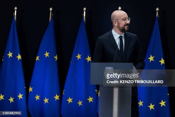 Newly appointed European Council President Charles Michel gives a speech during the handover ceremony between outgoing European Council President...
