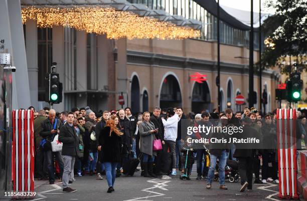 Members of the public are held behind a police cordon near London Bridge train station after reports of shots being fired on London Bridge on...