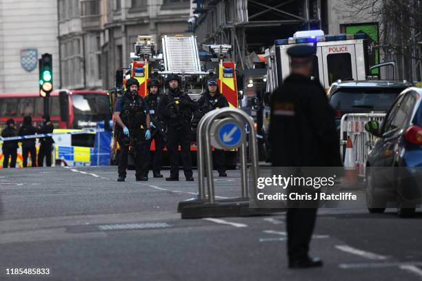 Metropolitan Police Armed Response officers gather near Borough Market after a number of people are believed to have been injured after a stabbing at...
