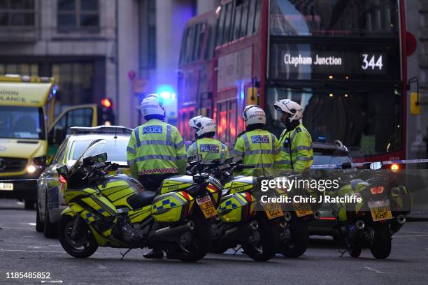 Metropolitan Police officers gather near Borough Market after a number of people are believed to have been injured after a stabbing at London Bridge,...
