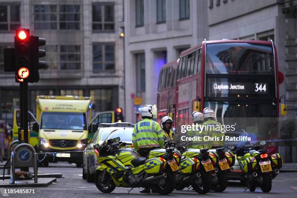 Metropolitan Police officers gather near Borough Market after a number of people are believed to have been injured after a stabbing at London Bridge,...