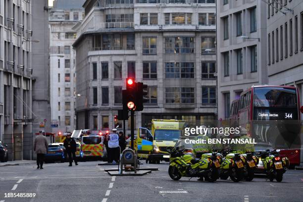Emergency vechiles and personel gather at Leadenhall near London Bridge in central London, on November 29, 2019 after reports of shots being fired on...