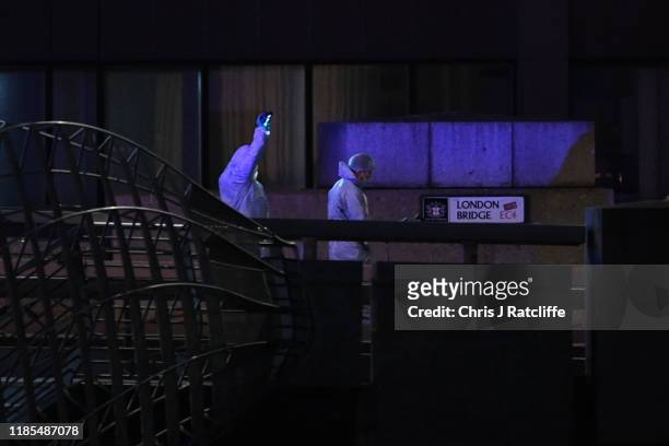 Forensic investigator takes photos by London Bridge after a number of people are believed to have been injured after a stabbing, police have said, on...