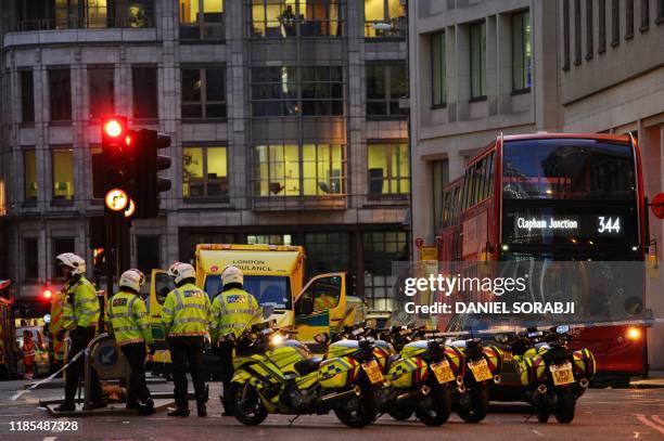 Police and emergency vechiles gather at Leadenhall near London Bridge in central London, on November 29, 2019 after reports of shots being fired on...