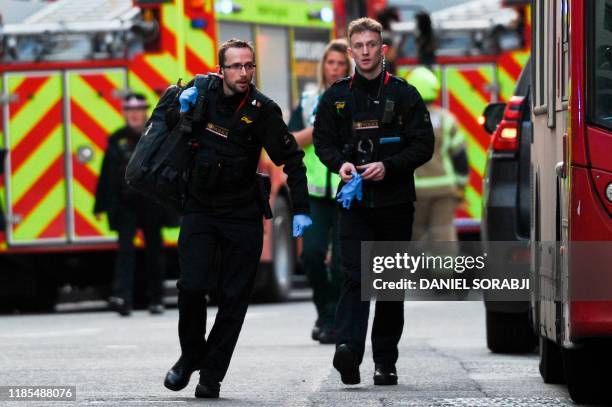 Police and emergency vechiles gather near London Bridge in London, on November 29, 2019 after reports of shots being fired on London Bridge. - A man...