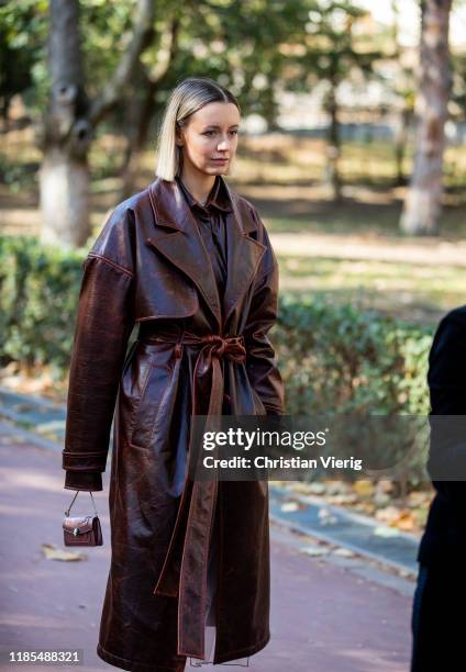 Nataly Osmann is seen wearing brown belted coat, mini bag during day 4 of the Mercedes-Benz Tbilisi Fashion Week on November 03, 2019 in Tbilisi,...