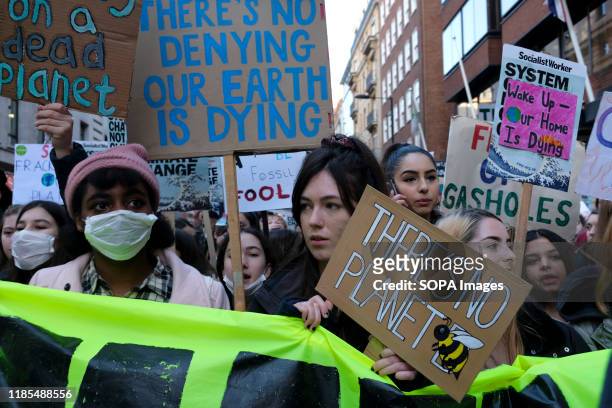 Environmental protesters with placards during the strike. Children, young people, and adults join together in a strike to highlight the climate and...