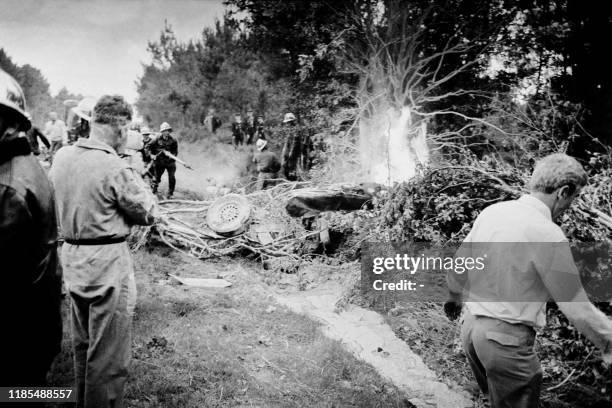 Firefighters intervene after an accident between the Peugeot CD SP 66 n°51 of French driver Jean-Claude Ogier and the ASA 613 RB n° 54 of French...