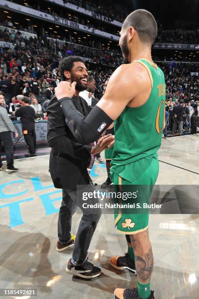 Kyrie Irving of the Brooklyn Nets and Jayson Tatum of the Boston Celtics greet each other after the game on November 29, 2019 at Barclays Center in...