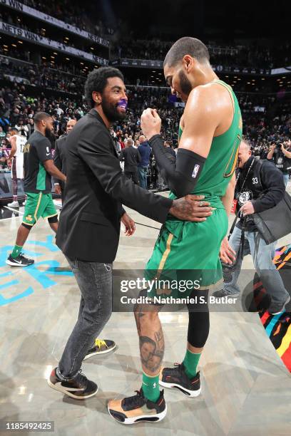 Kyrie Irving of the Brooklyn Nets and Jayson Tatum of the Boston Celtics greet each other after the game on November 29, 2019 at Barclays Center in...