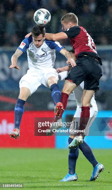 Simon Zoller of Bochum and Fabian Nuernberger of Nuernberg go up for a header during the Second Bundesliga match between VfL Bochum 1848 and 1. FC...
