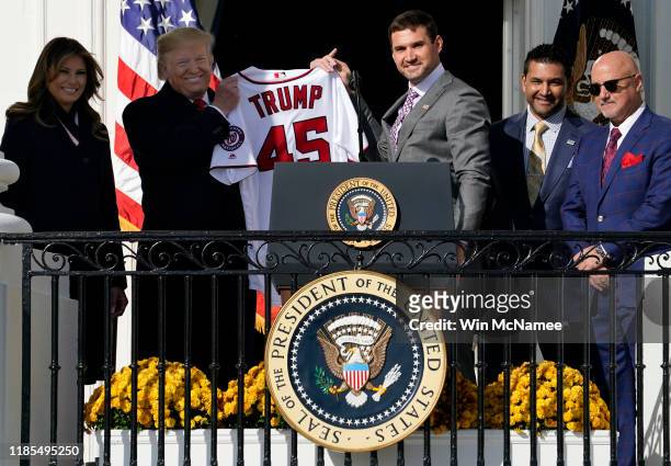 First baseman Ryan Zimmerman presents a Nationals jersey to U.S. President Donald Trump as he Trump welcomes the 2019 World Series Champions, the...