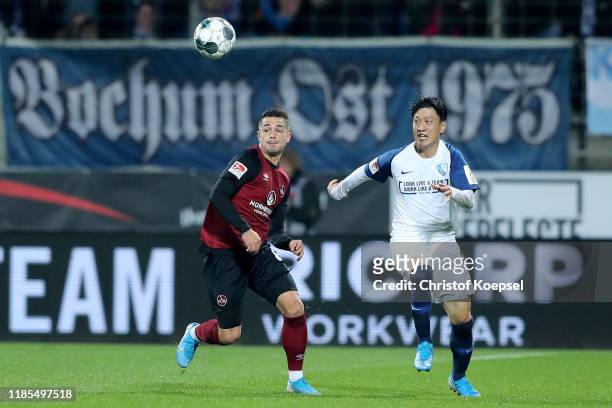 Nikola Dovedan of Nuernberg challenges Chung-yong Lee of Bochum during the Second Bundesliga match between VfL Bochum 1848 and 1. FC Nürnberg at...