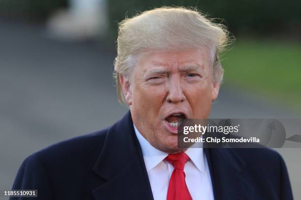 President Donald Trump talks to journalists while departing the White House November 04, 2019 in Washington, DC. Trump is traveling to Kentucky for a...